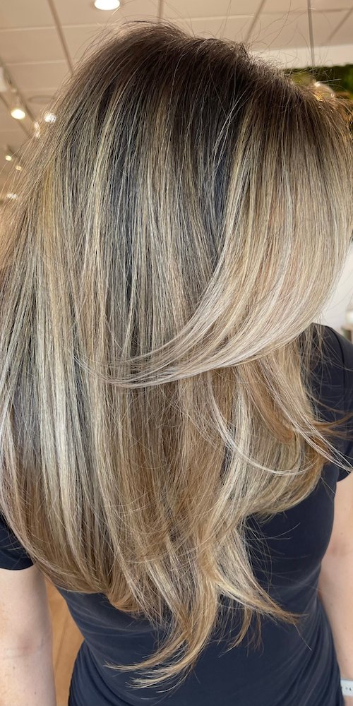 Face-framing layers with lived-in blonde highlights