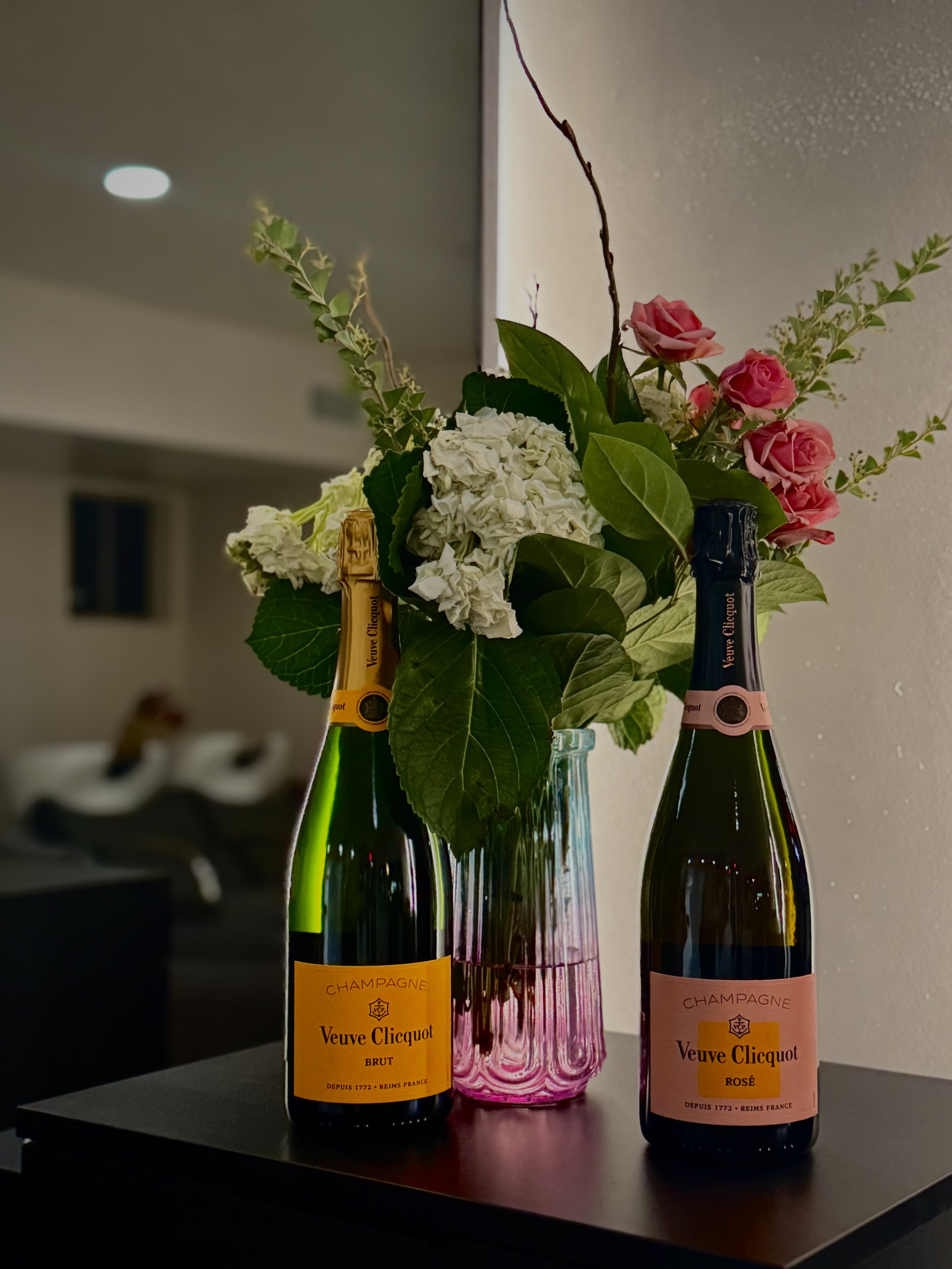 Champagne and fresh flowers in The Cosmo Lab salon lounge